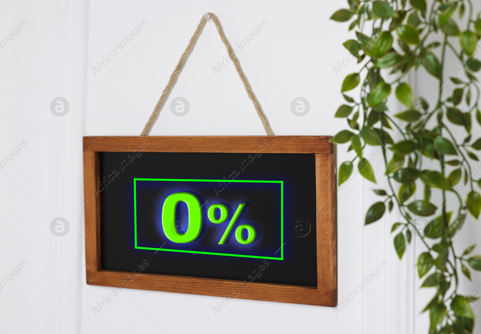 Image of Zero percent commission. Chalkboard with 0% hanging on door