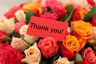 Image of Thank tag and bouquet of beautiful roses, closeup
