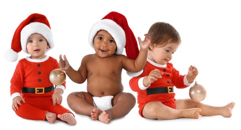 Image of Adorable babies with Santa hats and Christmas balls on white background