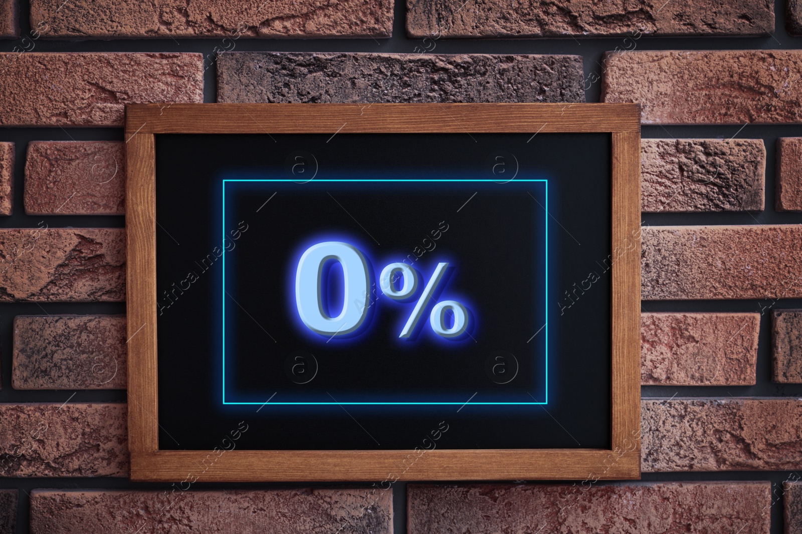 Image of Zero percent commission. Chalkboard with 0% hanging on brick wall