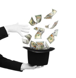 Image of Magician performing trick with money flying out of hat against white background, closeup