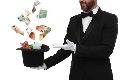Image of Magician performing trick with money flying out of hat against white background, closeup