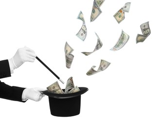 Image of Magician performing trick with money flying out of hat against white background, closeup