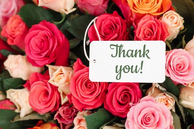 Image of Thank tag and bouquet of beautiful roses, closeup
