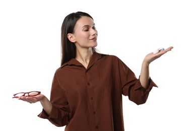 Photo of Woman choosing between glasses and contact lenses on white background