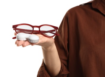 Photo of Woman choosing between glasses and contact lenses on white background, closeup