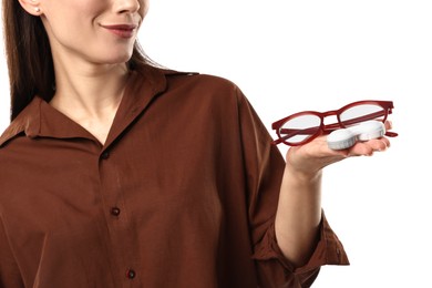 Photo of Woman choosing between glasses and contact lenses on white background, closeup