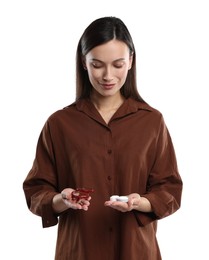 Photo of Woman choosing between glasses and contact lenses on white background