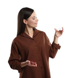 Photo of Woman choosing between glasses and contact lenses on white background
