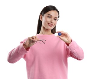 Photo of Woman choosing between glasses and contact lenses on white background