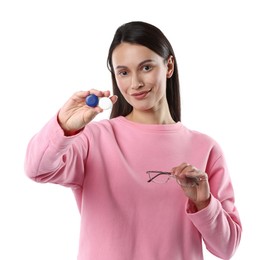 Photo of Woman choosing between glasses and contact lenses on white background