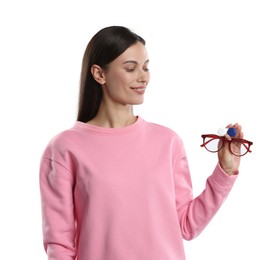 Photo of Woman choosing between glasses and contact lenses on white background
