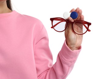Photo of Woman choosing between glasses and contact lenses on white background, closeup