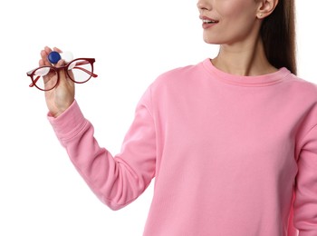 Photo of Woman choosing between glasses and contact lenses on white background, closeup