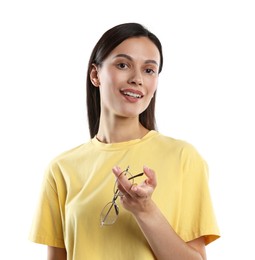 Photo of Woman choosing between glasses and contact lens on white background
