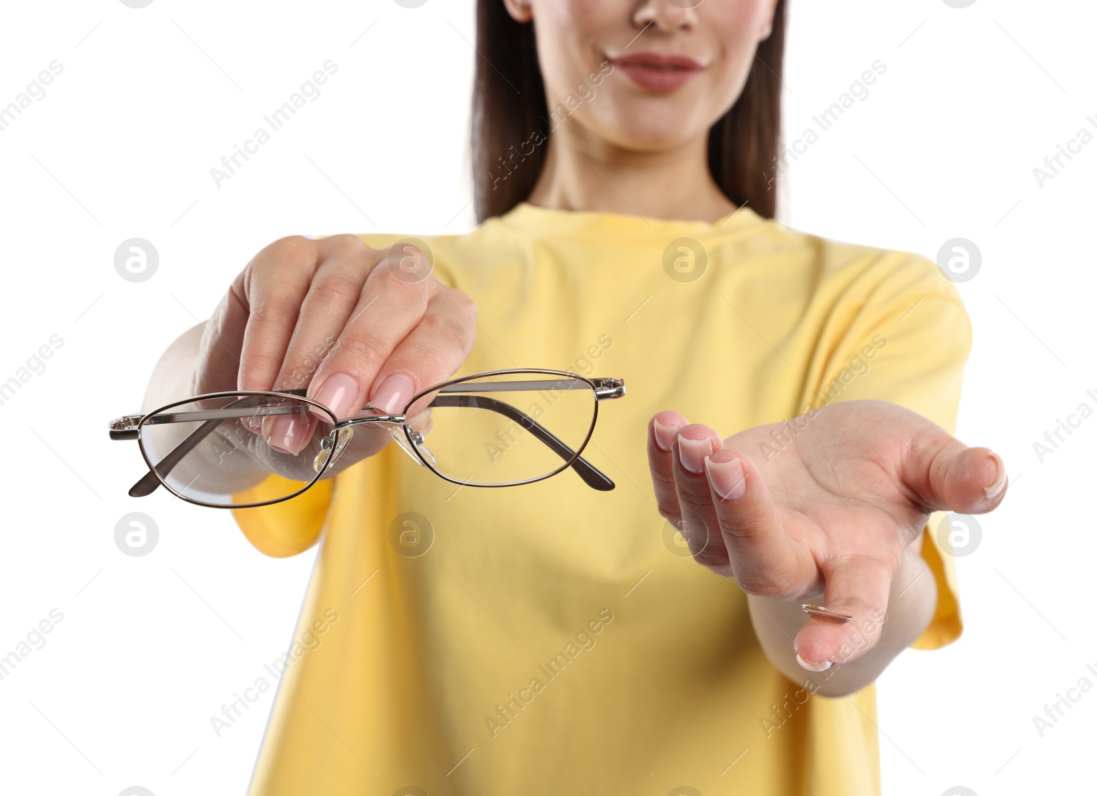 Photo of Woman choosing between glasses and contact lens on white background, closeup