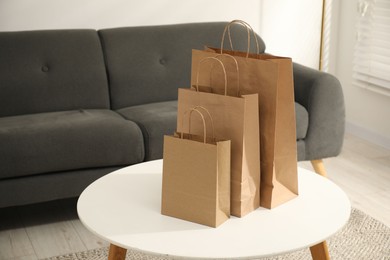 Photo of Paper bags on white table in room