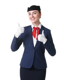 Photo of Beautiful stewardess showing thumbs ups on white background
