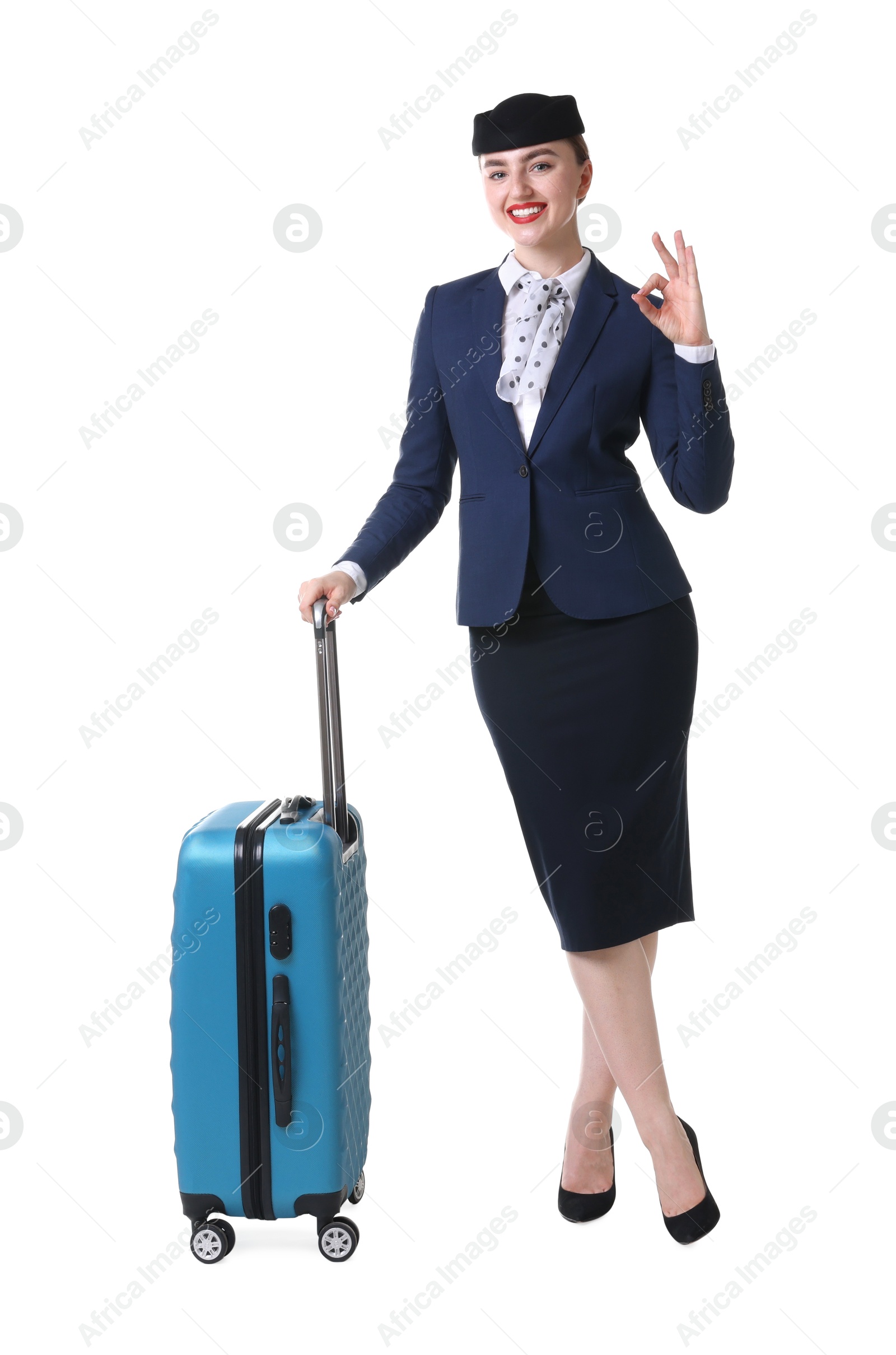 Photo of Positive stewardess with suitcase on white background