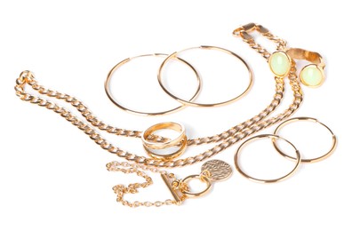 Photo of Many different gold jewelry isolated on white