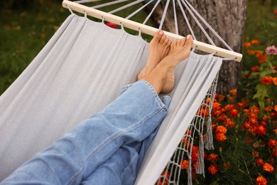 Photo of Senior woman resting in hammock outdoors, closeup