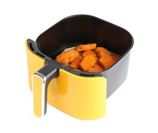 Photo of Air fryer basket with chicken nuggets isolated on white