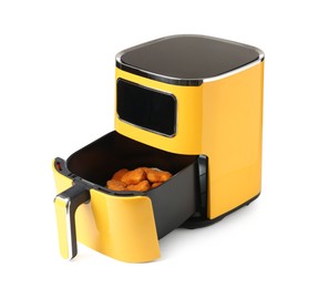 Photo of Air fryer with cooked chicken nuggets isolated on white