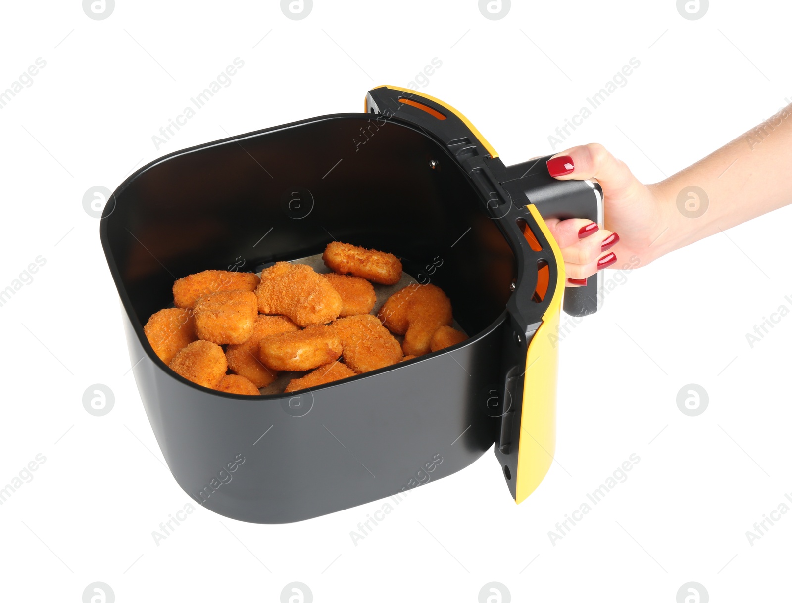 Photo of Woman with chicken nuggets in air fryer basket on white background, closeup