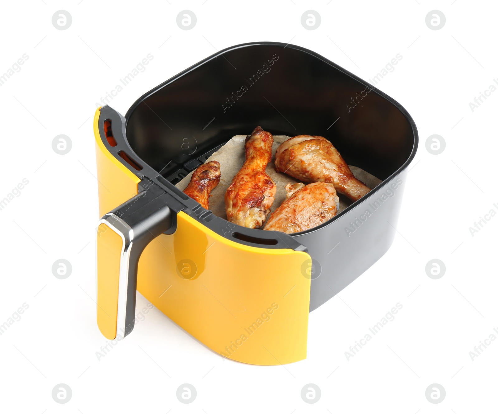 Photo of Air fryer basket with chicken drumsticks isolated on white