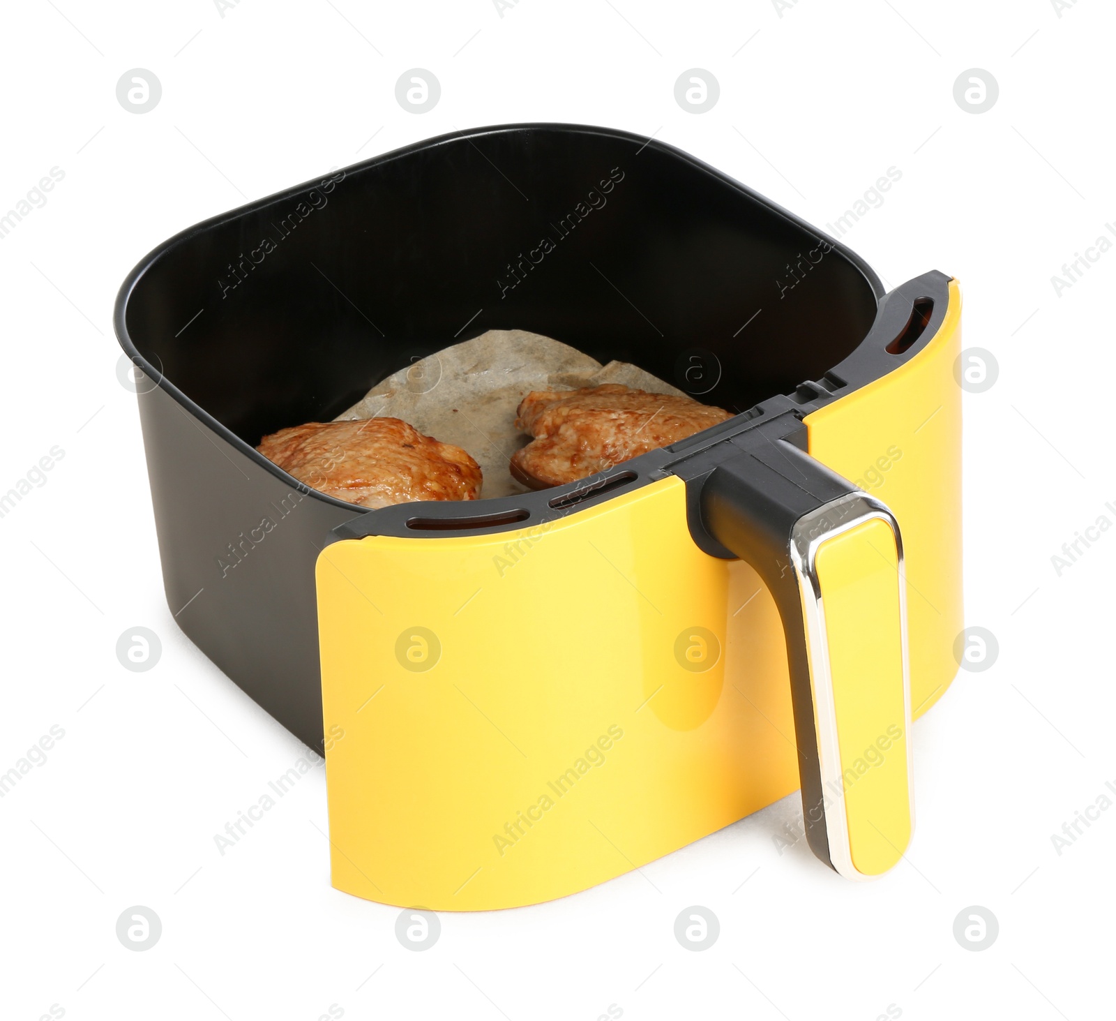 Photo of Air fryer basket with chicken thighs isolated on white