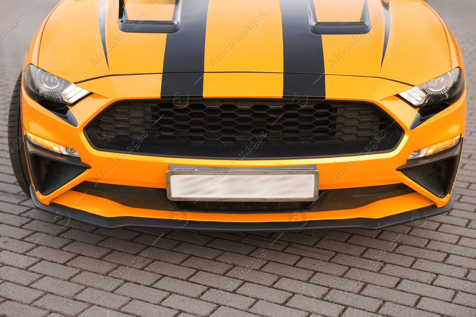 Photo of Modern cabriolet parked on parking lot outdoors, closeup