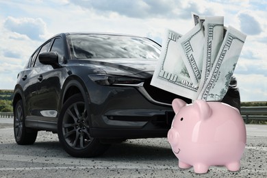 Image of Save money for car. Pink piggy bank with dollars near automobile outdoors
