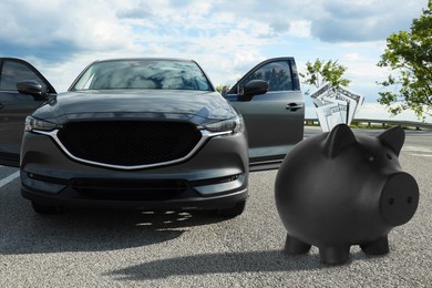 Image of Save money for car. Black piggy bank with dollars near automobile outdoors