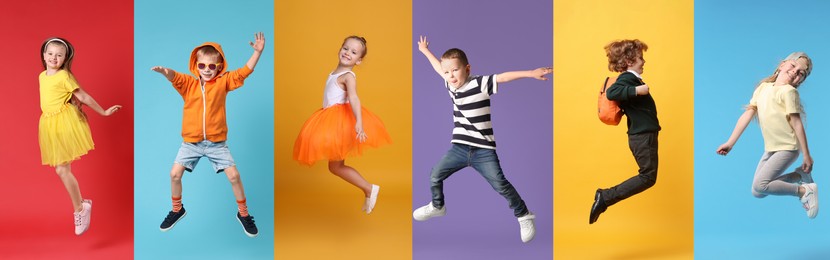 Image of Funny children jumping against colorful backgrounds. Group of girls and boys