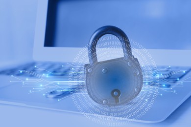 Image of Padlock with digital binary code and circuit board pattern on laptop. Password for cyber security