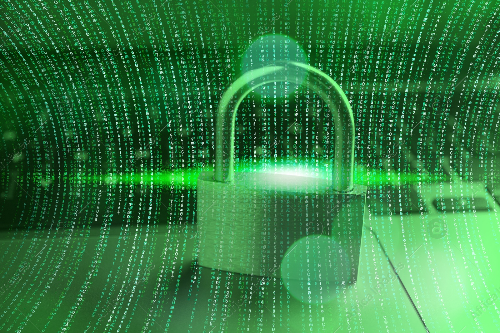 Image of Padlock on laptop and programming code, toned in green. Cyber security