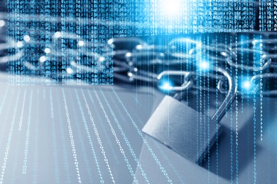 Image of Padlock with chain on laptop, toned in blue. Programming codes. Cyber security