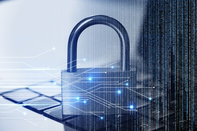 Image of Padlock on laptop, circuit board pattern and programming code. Cyber security