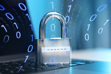 Image of Padlock with digital password lines on laptop, closeup. Binary code. Cyber security