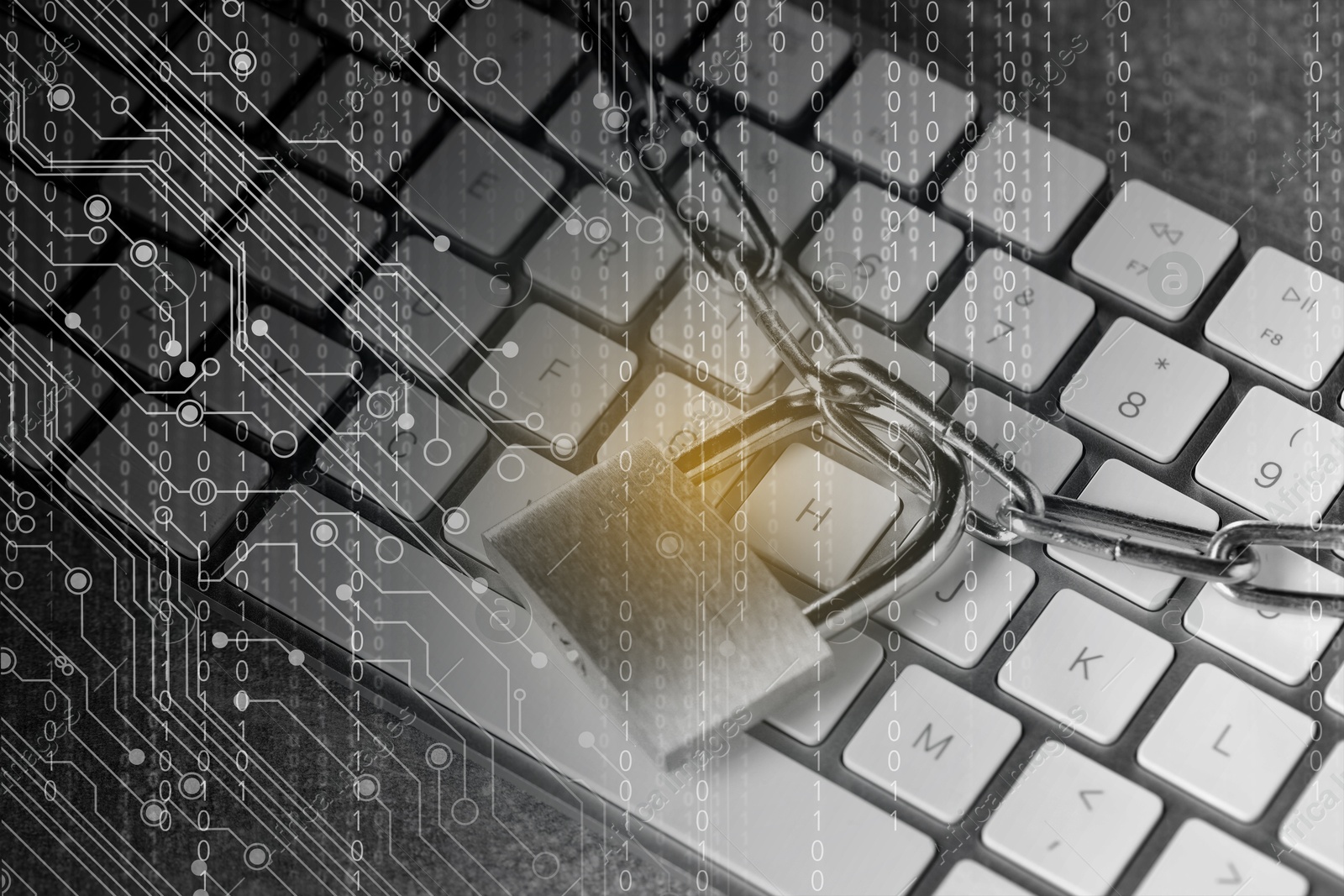 Image of Padlock and chain on computer keyboard, closeup. Circuit board pattern and binary code. Cyber security