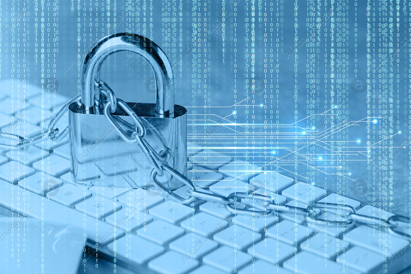Padlock and chain on computer keyboard, toned in blue. Circuit board pattern and binary code. Cyber security Image of Padlock and chain on computer keyboard, toned in blue. Circuit board pattern and binary code. Cyber security
