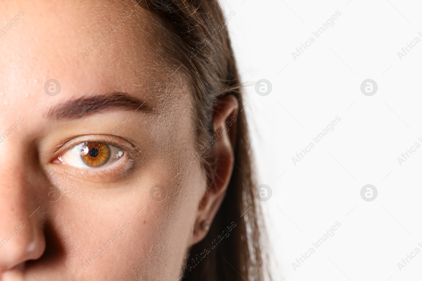 Photo of Woman with beautiful eyes on light background, closeup. Space for text