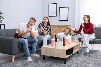 Photo of Young man singing karaoke with friends at home