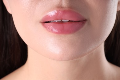 Photo of Woman with beautiful lipgloss on her lips , macro view