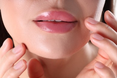 Photo of Woman with beautiful lipgloss on her lips , macro view