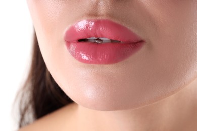 Photo of Woman with beautiful pink lipstick on her lips against white background, closeup