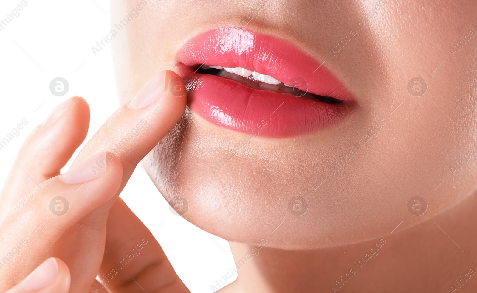 Photo of Woman with beautiful pink lipstick on her lips against white background, closeup