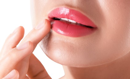 Photo of Woman with beautiful pink lipstick on her lips against white background, closeup