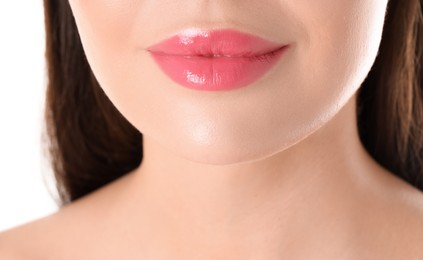 Photo of Woman with beautiful pink lipstick on her lips against white background, closeup