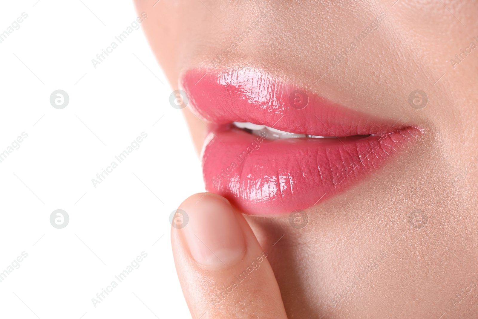 Photo of Woman with beautiful pink lipstick on her lips against white background, closeup